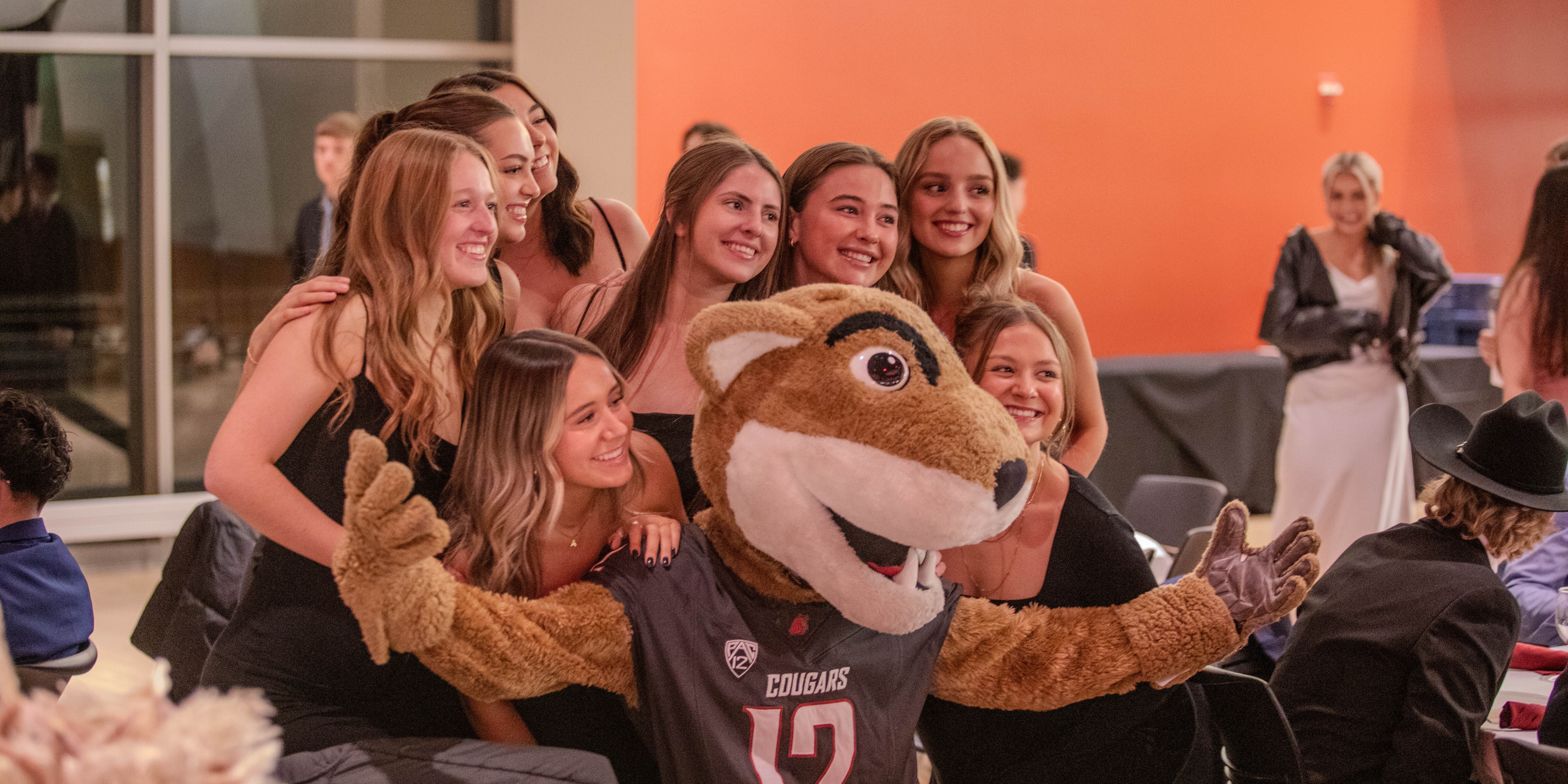 students pose with cougar mascot